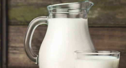 jug of milk with glass of milk
