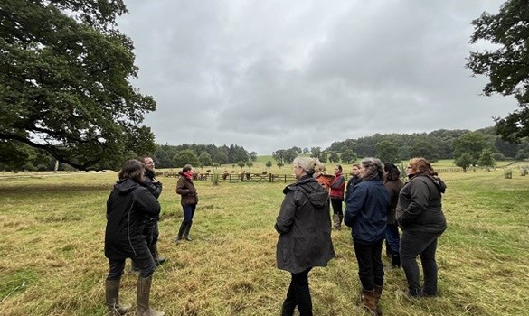 Farmers standing in a field.