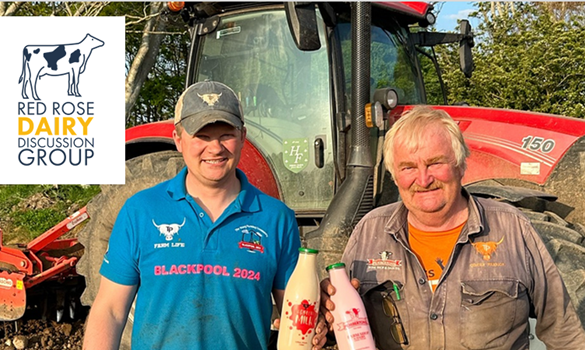 Tom and Andrew Pemberton standing in front of a tractor.