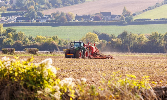 Tractor driving through a field