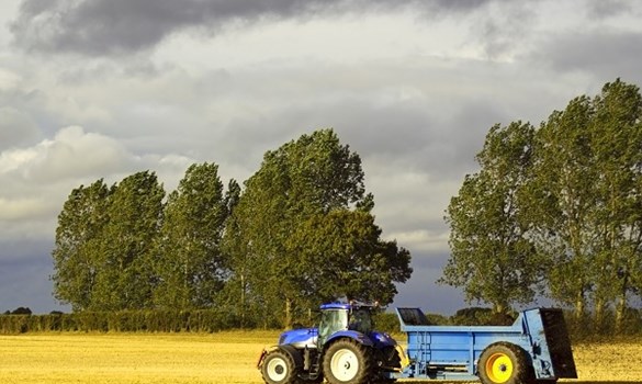 Tractor driving through field