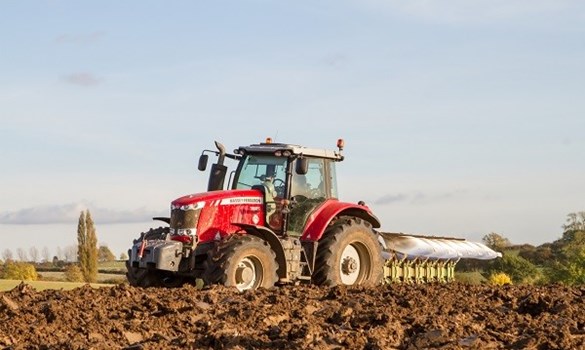 Red tractor in a field