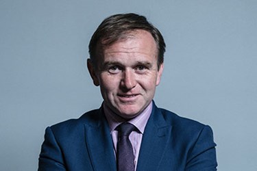 George Eustice in a suit